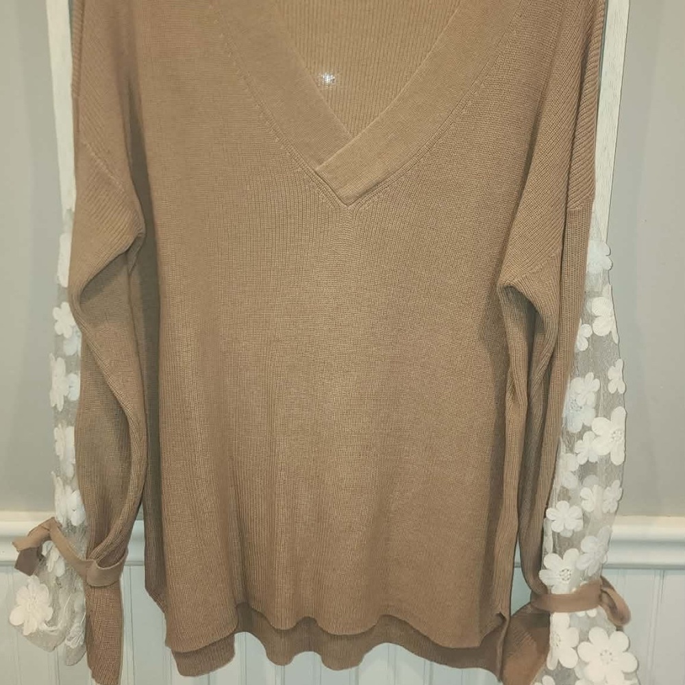 Beautiful V Neck sweater top with embroidered sleeves that will wow you!!